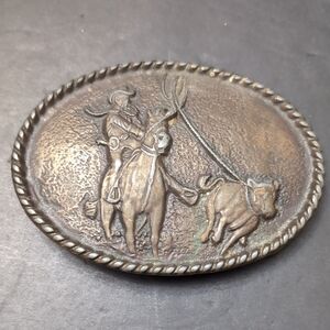 VGT,Western Oval Metal Belt Buckle Features A Cowboy Roping A Bull.